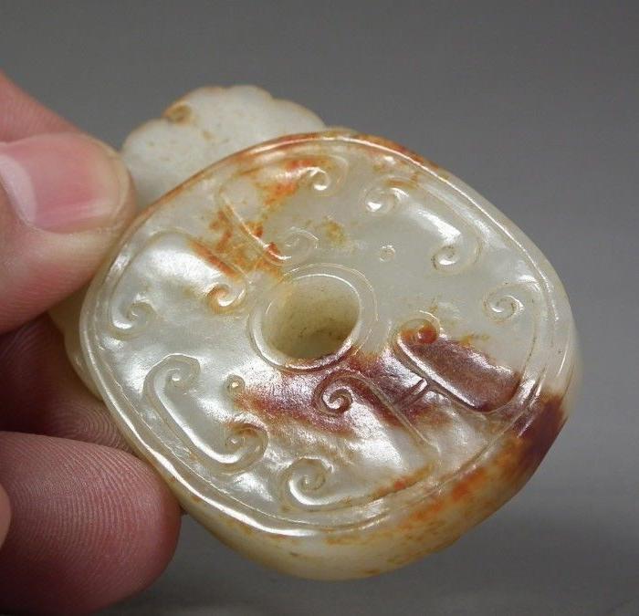 明代和田白玉带红沁出廓卷云兽面大玉佩